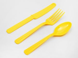 Disposable plastic spoon with gold trim
